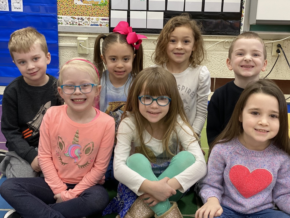Kindergarten students smiling for a picture