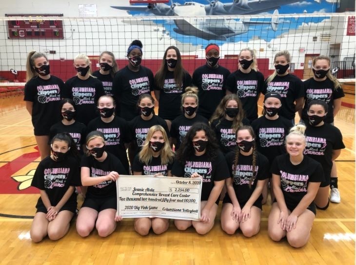 Volleyball team picture with check for Joanie Abdu Comprehensive Breast Care Center